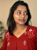 Poppy Field Embroidered Peplum Top — Maroon